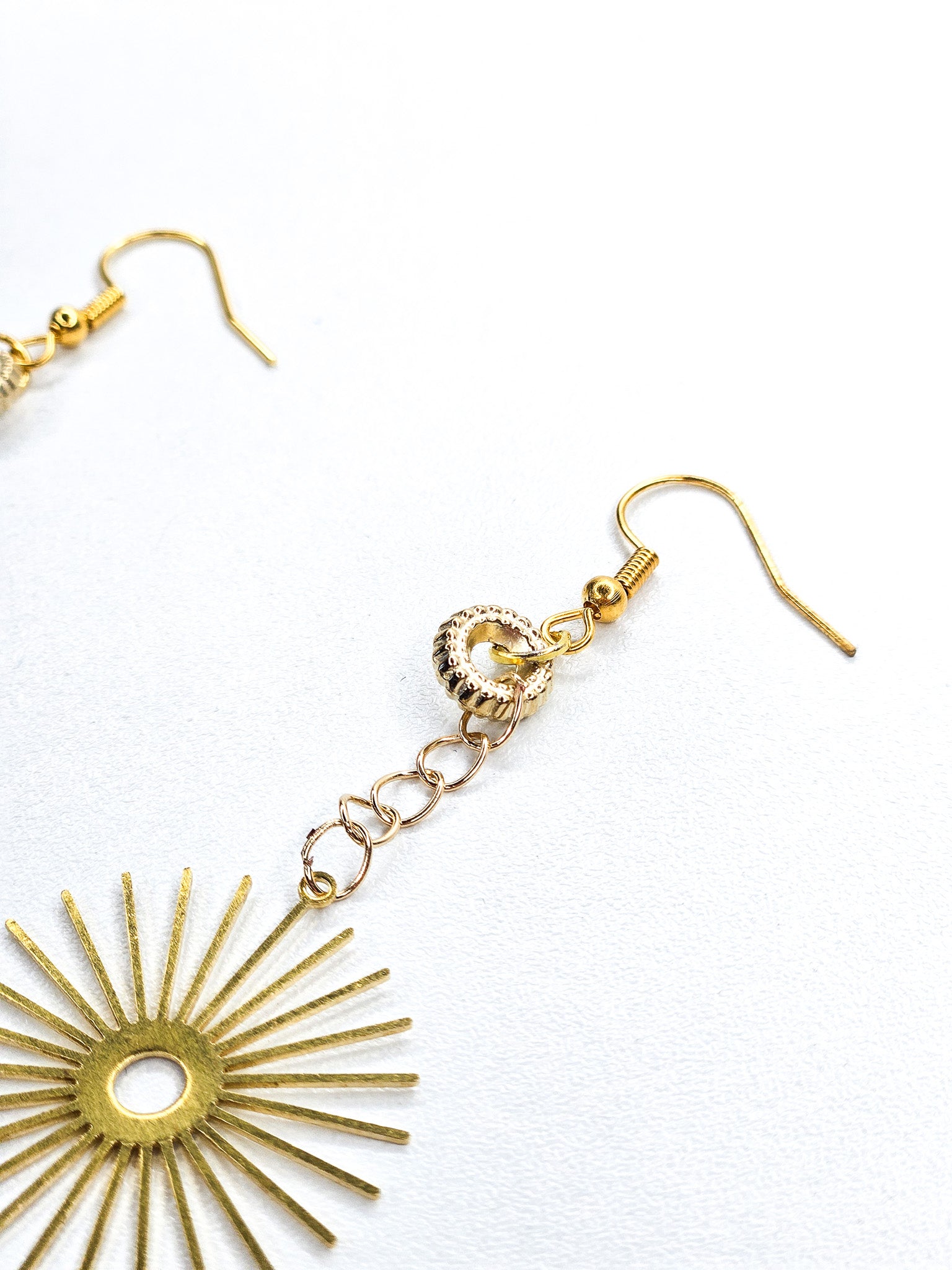 Boucles d'oreilles dorées • Soleil
